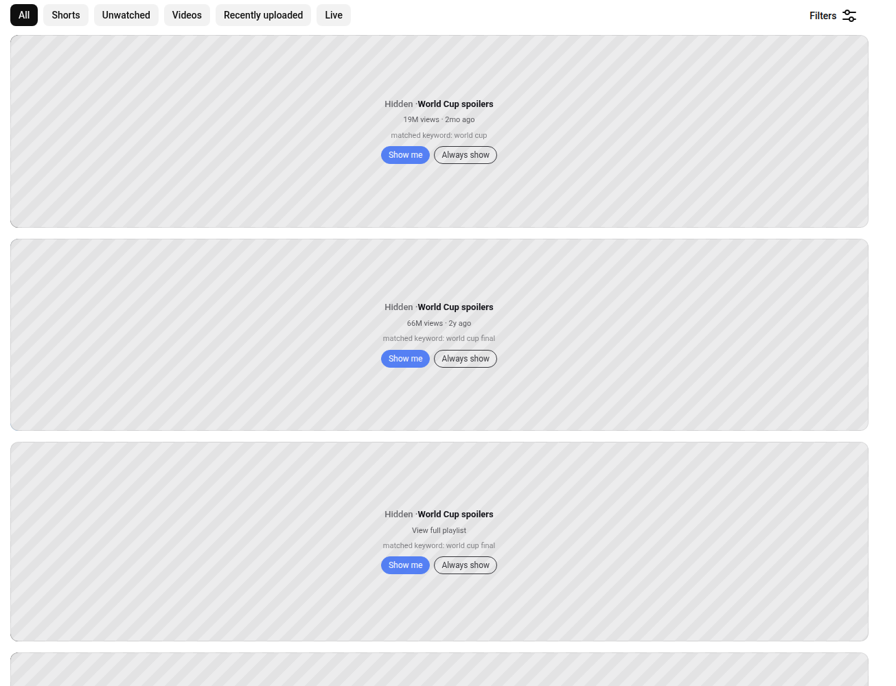 The same results covered by grey SpoilerGuard panels saying World Cup spoilers